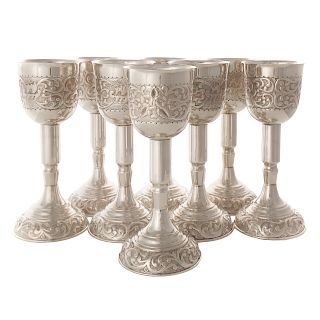 Set of eight repousse silver goblets