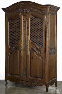 Reproduction French carved oak armoire, 84'' h., 47 1/2'' w.