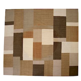 Alfombra. Siglo XX. Estilo patchwork. Elaborada en fibras de lana y algodón. Colores marrón y beige.