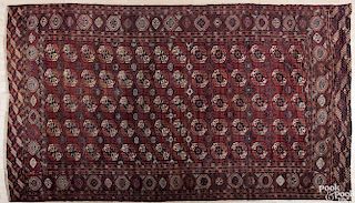 Bohkara carpet, early 20th c., 13' x 7'5''.
