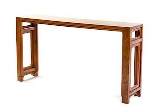 A Contemporary Huanghuali Table Height 31 1/2 x width 60 x depth 13 inches.