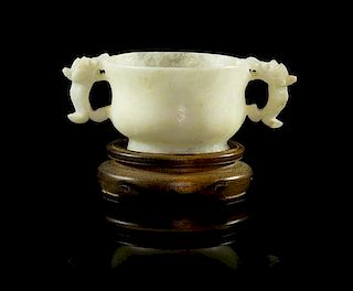 A Carved Jade Libation Cup Width over handles 3 1/2 inches.