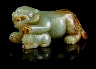 * A Carved Jade Figure of a Lioness and Cub Width 4 inches.
