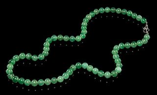 A Jadeite Beaded Necklace. Length overall 16 1/4 inches.