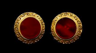 A Pair of 18 Karat Gold and Carnelian Earclips Diameter 1 1/4 inches.