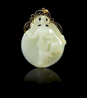* A Carved Jade Pendant Height 2 1/2 inches.