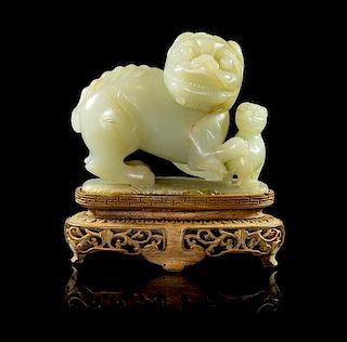* A Carved Jade Figural Group Height 3 inches (without stand).