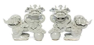 A Pair of Blanc-de-Chine Models of Fu Lions Height of first 8 inches.