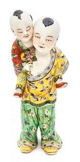 A Polychrome Porcelain Figural Group Height 16 1/8 inches.