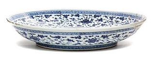 * A Blue and White Porcelain Charger Height 3 x diameter 15 inches.