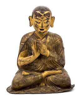 A Gilt Bronze Figure of a Monk Height 13 inches.