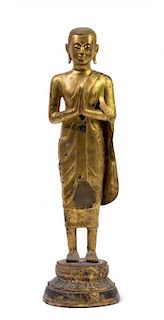 * A Thai Gilt Bronze Figure of a Monk Height 20 1/2 inches.