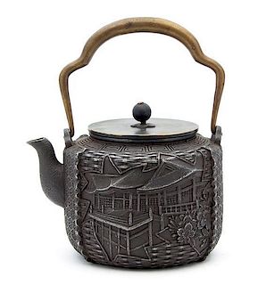 A Japanese Bronze Tea Kettle Height 6 3/8 inches.