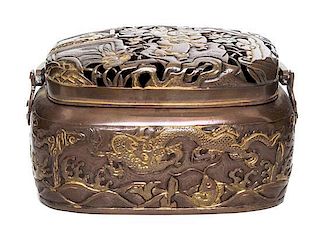 A Japanese Copper Handwarmer Height 3 x width 5 1/2 x depth 3 7/8 inches.