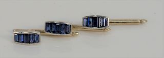 Cartier set of three white gold buttons, set with five baguette cut sapphires in each