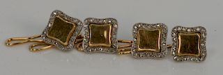 Set of four 18 karat gold and platinum buttons with modified square panel and diamond surround, no monogram. 
13.3 grams