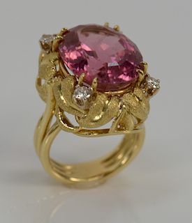 18 karat gold ring, set with pink tourmaline approximately 15 cts., each corner set with one single round brilliant cut diamond .32...