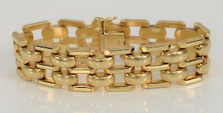 14 karat gold bracelet with domed connectors. 
length 7 1/2 inches, width 3/4 inch, 39.8 grams
