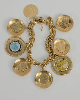 14 karat gold charm bracelet with 14 karat gold charms.
length 7 1/4 inches, 59.5 grams