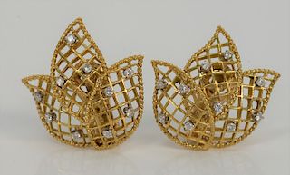 Pair of 14 karat gold ear clips of three part flower, set with ten small diamonds in each. 
11.6 grams