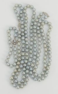 Three piece lot of three strands of cultured pearls including two necklaces and one bracelet, 
each with 14 karat white gold clasp, ...