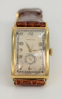 Patek Philippe for Tiffany 18 karat oversized hinged case curved rectangular wristwatch with gold breguet style numerals, Tiffany & ...