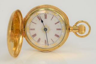 Elgin 18 karat gold pocket watch with enameled silver and gilt decorated face, marked Elgin Nat Watch Co. 32508. 
40 mm