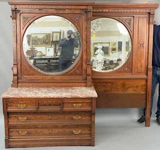 Eastlake Victorian two piece bedroom set,  walnut and burl walnut, each piece with carved top having lion's faces over round beveled...