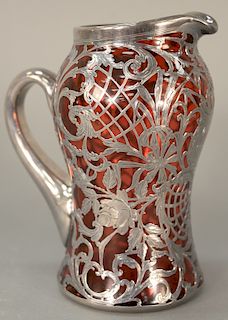 Cranberry silver overlay pitcher. 
height 8 1/2 inches
