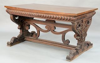 Renaissance style walnut writing desk with rectangular top on carved frieze,  fitted glass top and pierced carved sides with drawer ...