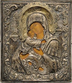 Russian icon, painted with embossed silver oklad with gilt crown, 19th century or earlier with two Christie's stickers on back