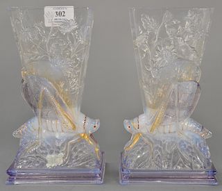 Pair of Baccarat opalescent grasshopper vases, modeled with grasshopper and floral decoration, marked on bottom: Baccarat (chips). 
...