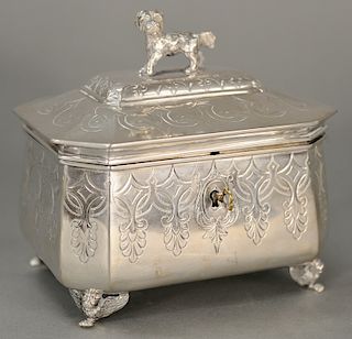 Continental silver box with hinged cover, 
mounted with dog in a modified rectangle form on winged claw feet with key. 
height 5 1/2...