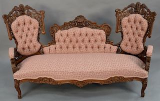 Victorian sofa of laminated rosewood, attributed to Baudoine,  having center north wind face and pierced carved back and sides, all ...