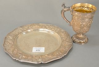 English silver cup and plate with repousse border and body, monogrammed 1887. 
cup: height 5 1/2 inches, 
plate: diameter, 
22 troy ...