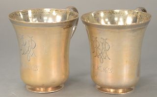 Two large Mexican silver mugs, monogrammed R M Mc G (one with dent at rim). 
height 4 1/2 inches, diameter 4 inches, 24.2 troy ounce...