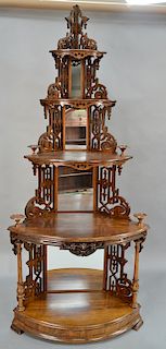 Victorian rosewood corner etagere with pierced carved supports and mirror corners. 
height 93 1/2 inches, width 40 inches, depth 24 ...