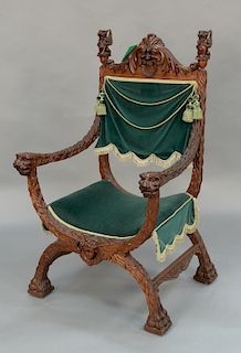 Carved mahogany armchair with winged griffin finials and lion carved hand rests, 
fur style carved arms and legs ending in paw feet ...