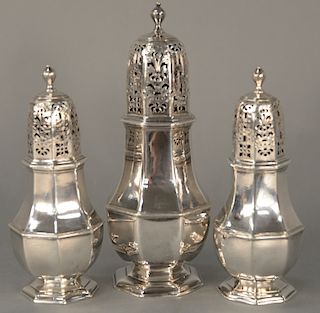 Charles Adams three sugar casters,  one large and a pair, all eight sided, circa 1719.  largest: ht. 7 1/2 inches (19.1 cm)  p...