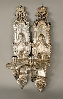 Anthony Nelm (1681-1722) pair of silver candle sconces, circa 1713, top with crown over scroll work over valance and swag with singl...