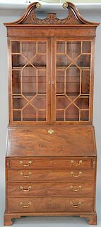 George III mahogany secretary desk in two parts, two glazed doors over drop front desk with leather writing surface over four drawe...
