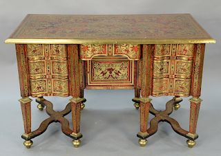 Boulle desk with rectangular top, 
over center drawer and door, flanked by three serpentine drawers on either side, all set on squar...