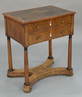Two drawer stand with tooled leather top, late 19th century (imperfection). 
height 28 inches, top: 16" x 23 1/2"