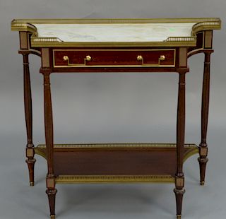 Continental style mahogany stand with marble top, 
having brass gallery over one drawer, on turned and fluted legs. 
height 32 inche...