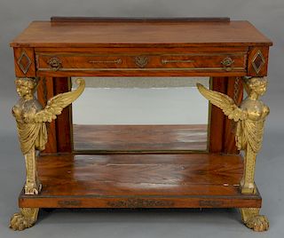 Mahogany pier table with drawer and bronze mounts, 
supported by carved and gilt caryatids, having mirrored back, set on base with g...