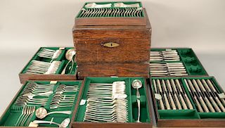 English silver flatware in two close patterns in custom box with six fitted trays to include (20) soup spoons, (24) tablespoons, (24...