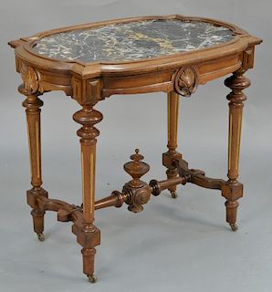 Victorian walnut table with inset grey, pink, and white marble. 
height 28 1/2 inches, top 22 1/2" x 33"

Provenance: 
Estate of Ste...