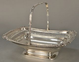 Paul Storr (1771-1844) silver cake basket,  having swing handle and gadrooned top edge with shell corners on rectangular footed base...