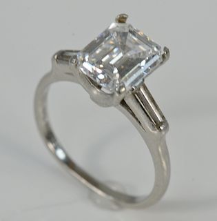 Platinum and diamond ring with center emerald cut diamond