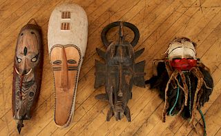 COLLECTION OF FOUR CARVED WOOD AFRICAN MASKS